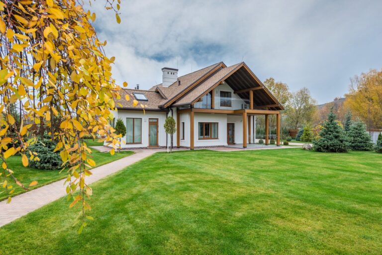 House with a large lawn during the winter fall season