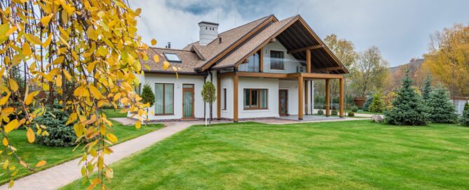House with a large lawn during the winter fall season